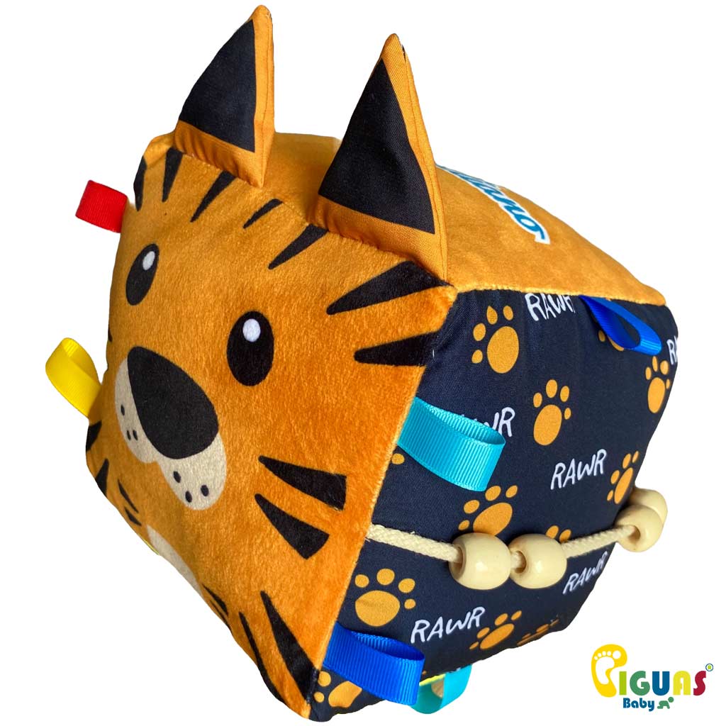 Un cubo sensorial con la cara de un tigre juguetón, perfecto para que tu bebé desarrolle sus habilidades jugando