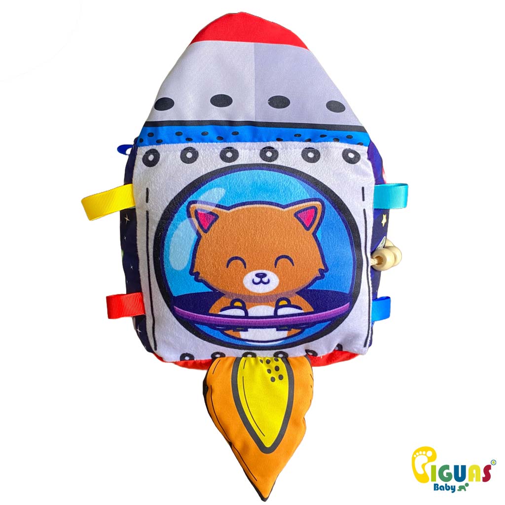 Un cubo sensorial para bebés con la forma de un Rocket feliz, perfecto para estimular la atención de tu pequeño.